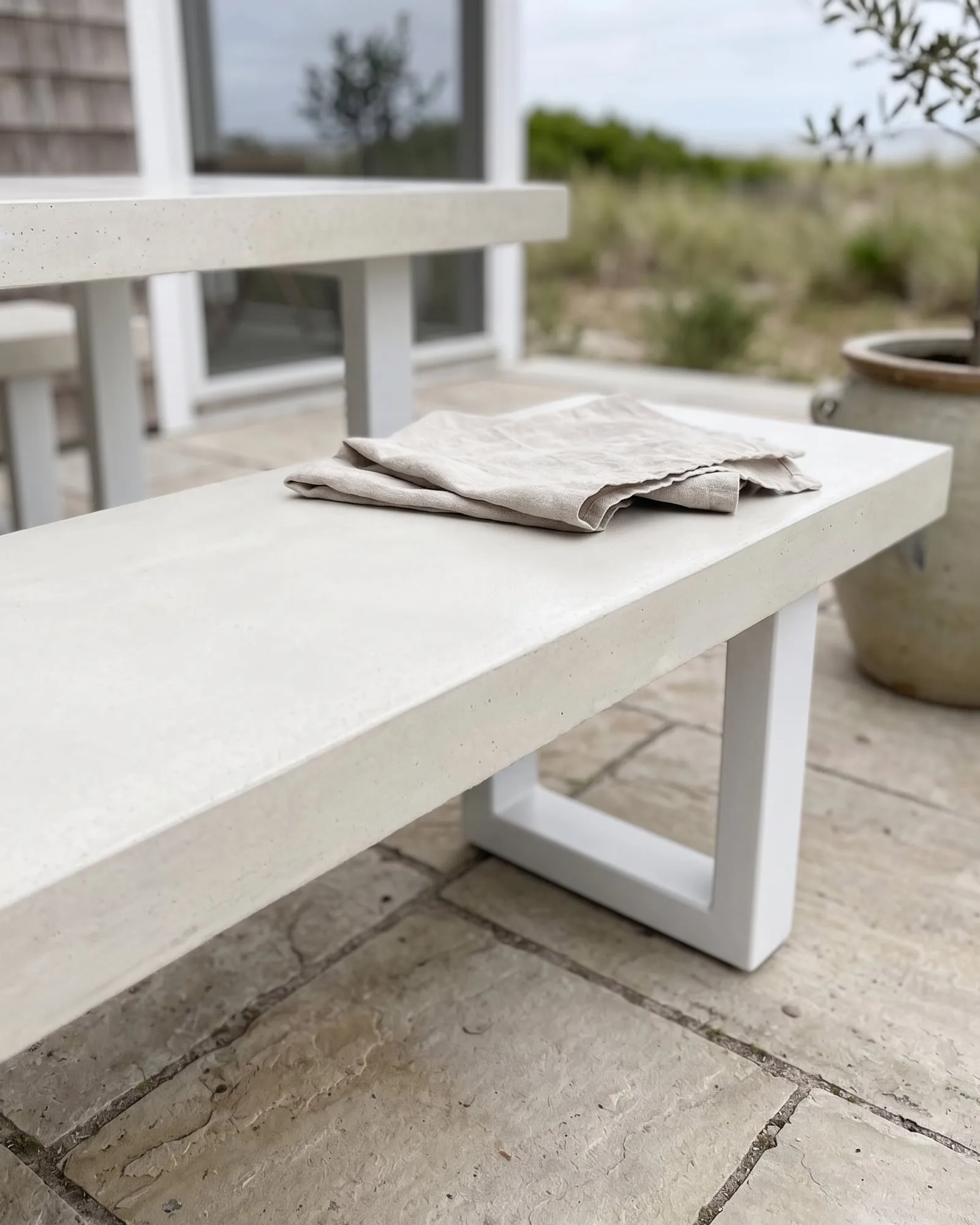 Concrete bench seats by SnapCo in IronStone finish, made-to-order for commercial and residential settings