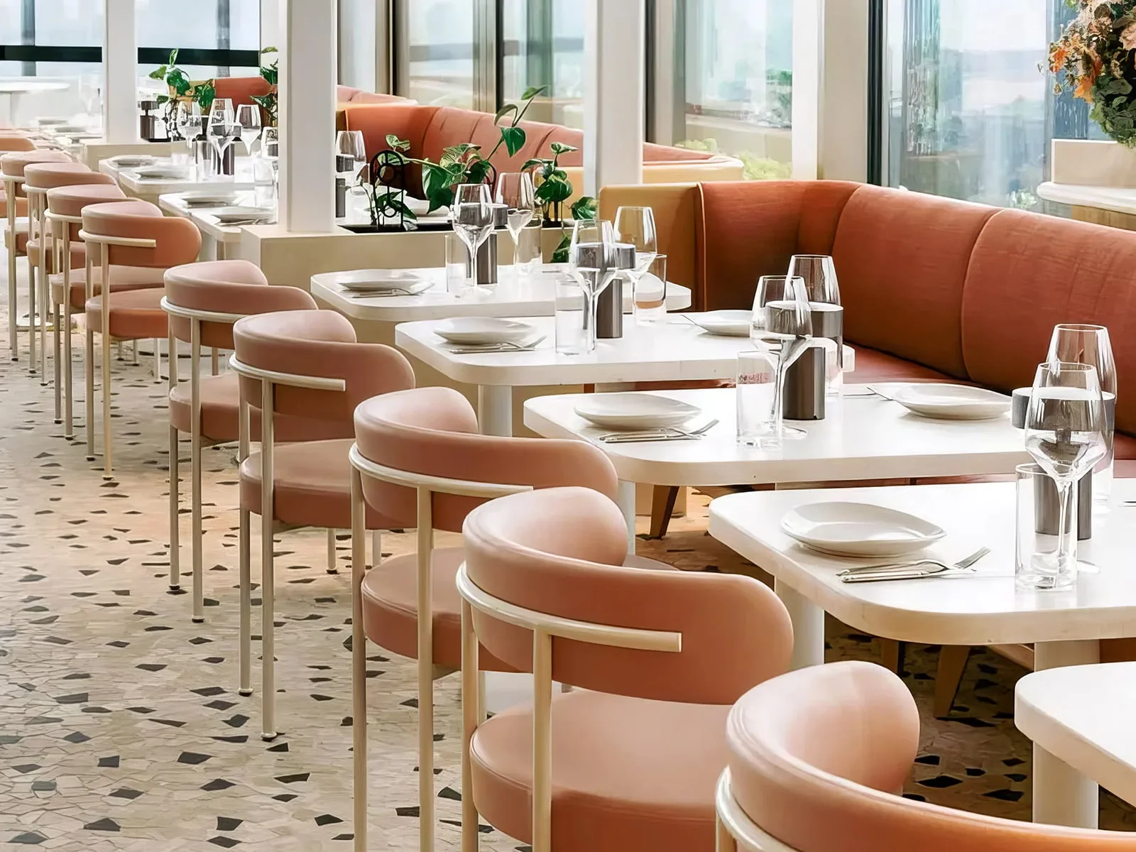 Concrete bar tables under the retractable glass roof at The Beverly Rooftop in Melbourne