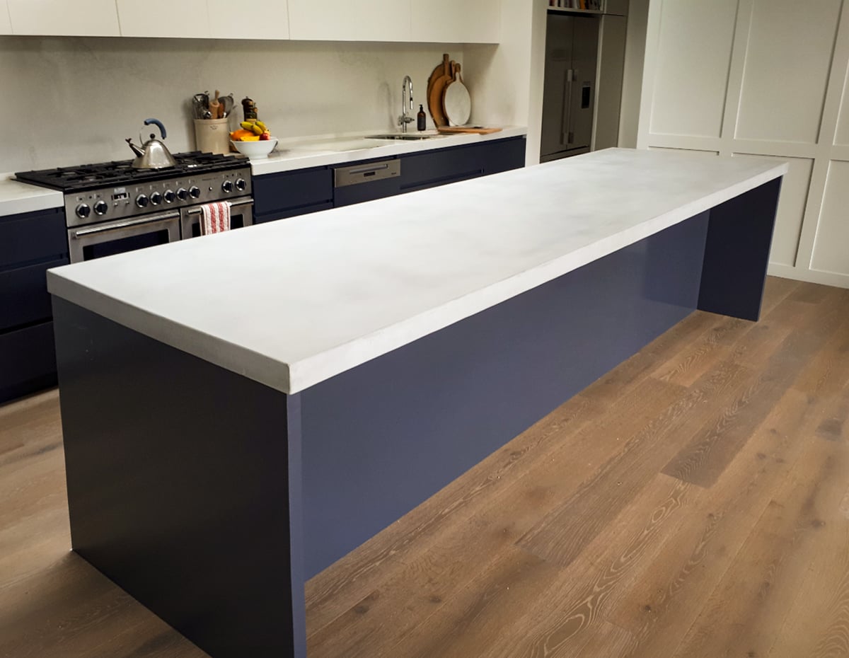 Statement concrete kitchen island by SnapCo styled as a butler's pantry showpiece for everyday gathering