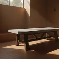 Farmhouse concrete dining table in a terracotta-tile room with window light, alternate angle