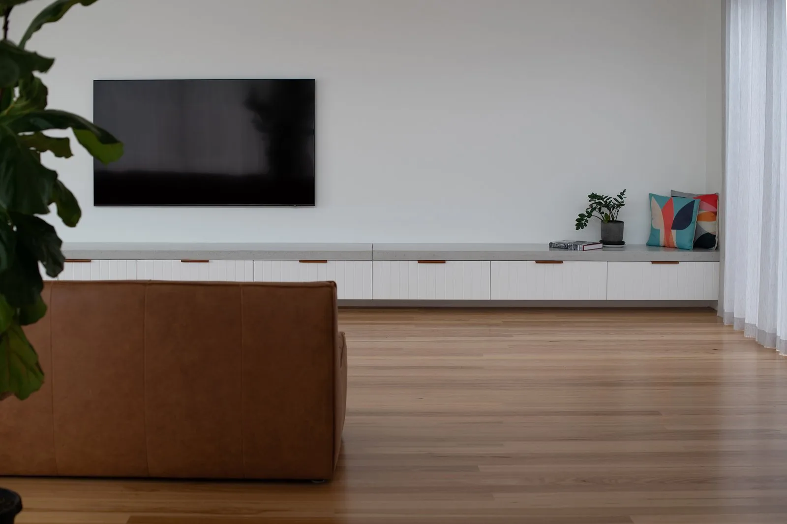 A SnapCo concrete bench-top surface in a Hampton Melbourne home, dry-zone application