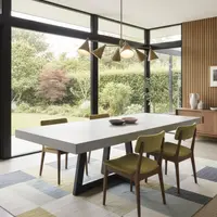 IronCross concrete dining table in a mid-century home with olive-green chairs and garden view