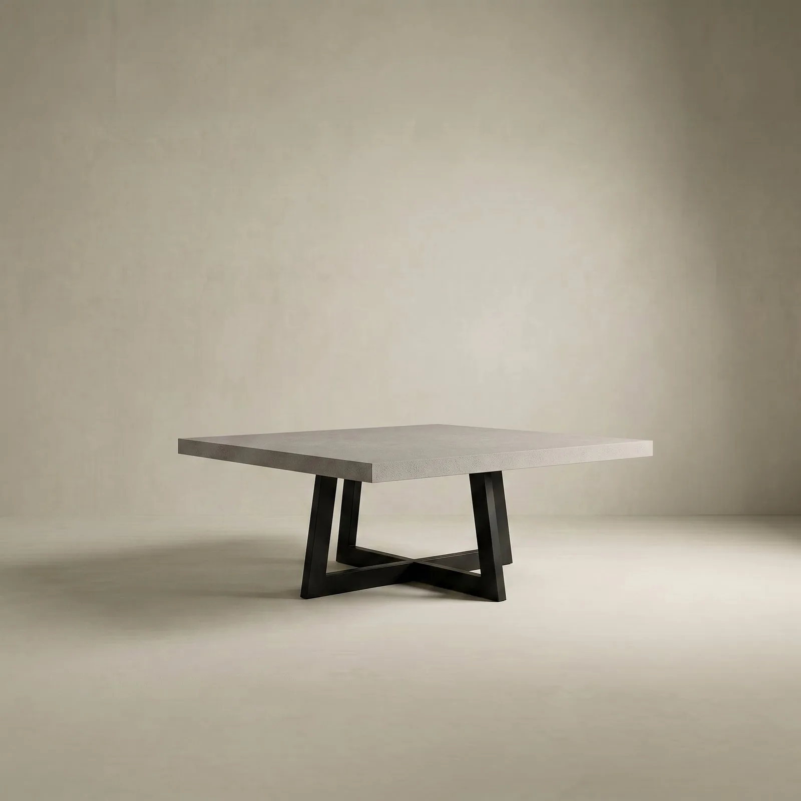 Studio render of the square IronCross concrete dining table on its black steel cross-base on a cream backdrop