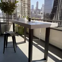 IronStone concrete bar table on a Melbourne high-rise balcony with city skyline behind