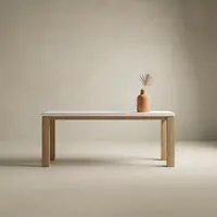 Laconian concrete hall table close-up showing the white concrete top, oak frame and stone-floor styling
