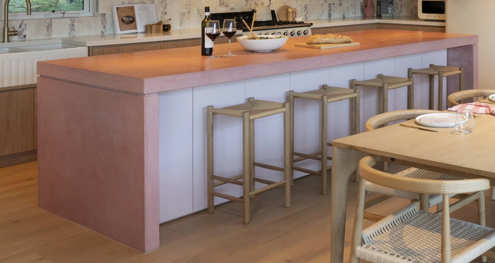 SnapCo pink concrete kitchen island on Love It or List It Australia Season 6, Research Victoria, with Smeg cream appliances and oak joinery