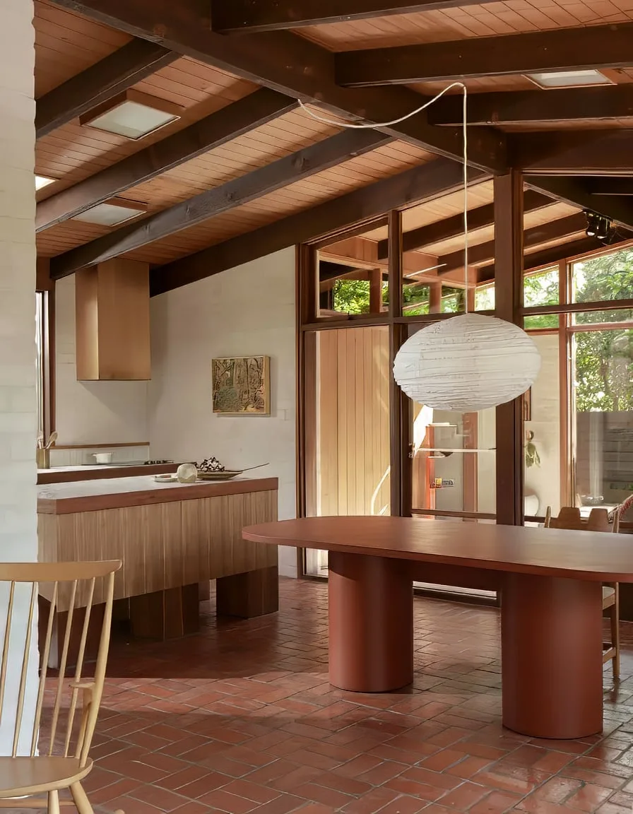 Lithos concrete dining table by SnapCo, hand-cast in Mordialloc with a honed mid-grey top and Tasmanian oak legs, styled in a contemporary Australian dining room
