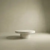 Milano concrete coffee table in bone white, round pedestal base, studio render