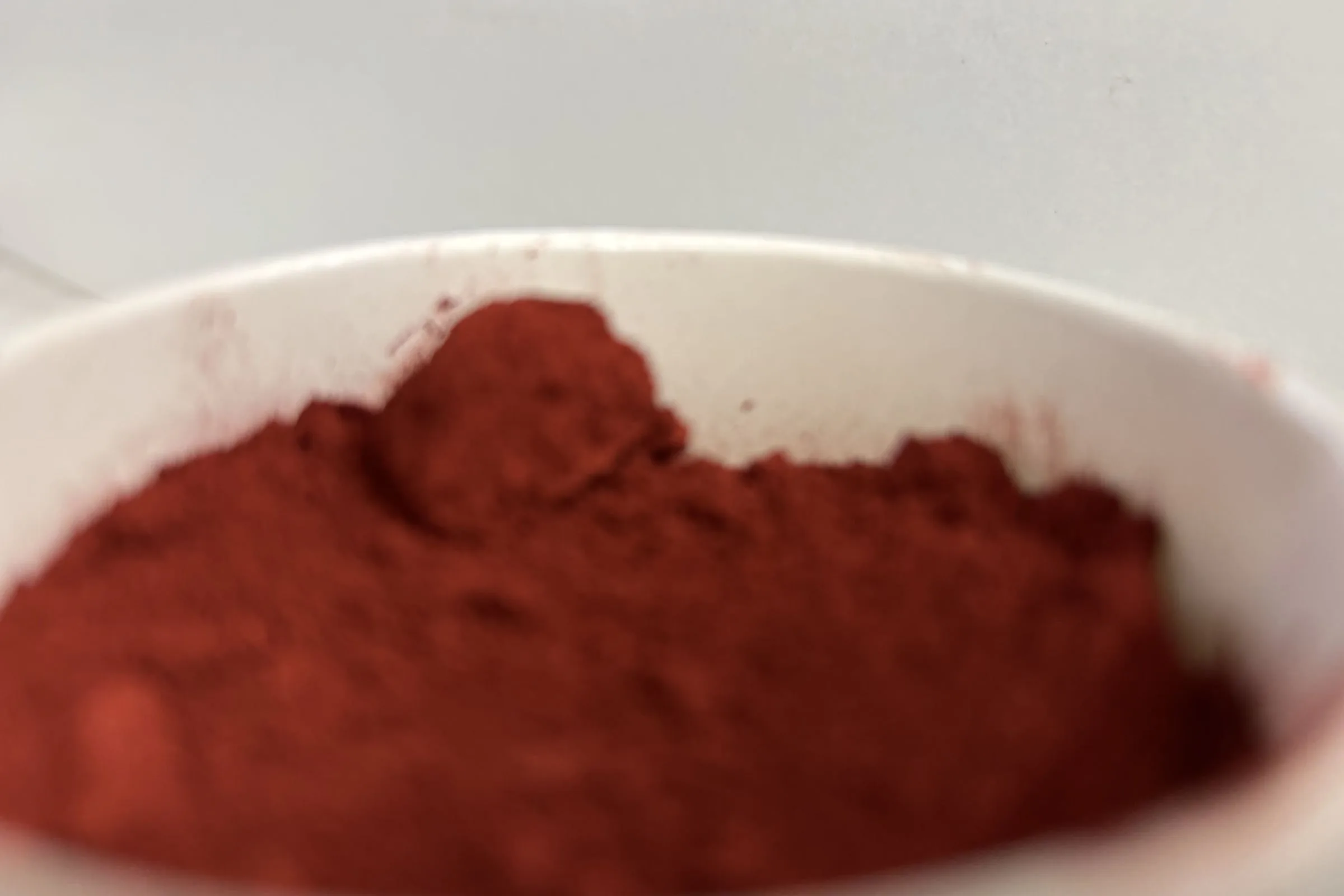 Red iron-oxide pigment swatch for SnapCo concrete colours, used in custom-coloured benchtops and furniture