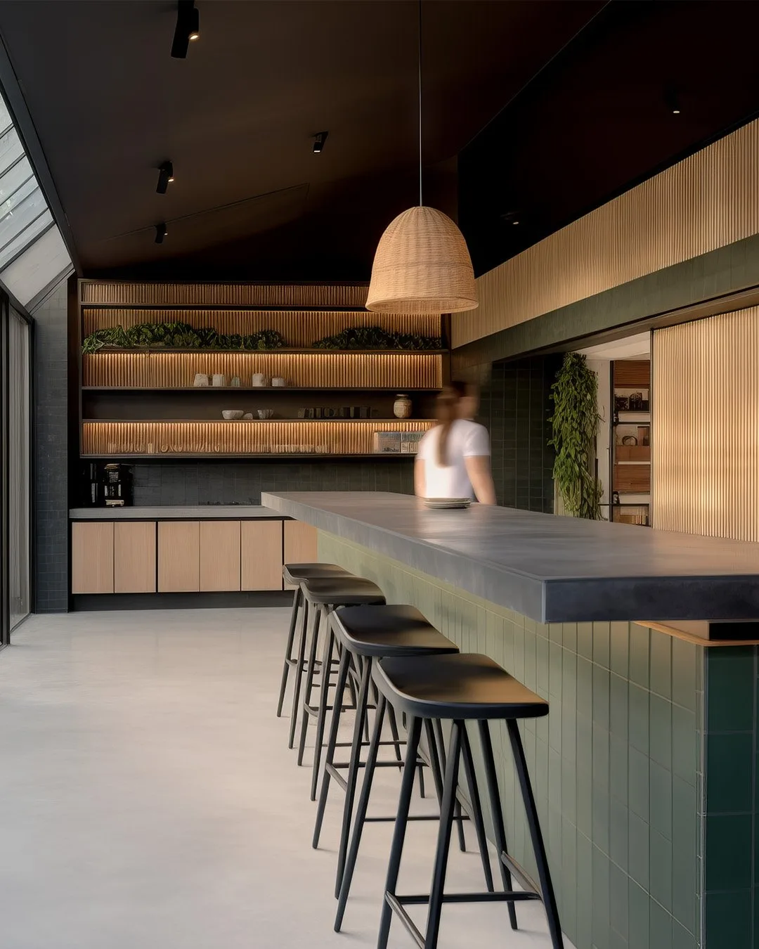 Polished concrete kitchen island and full benchtop run with timber slat island base and brass tapware in a Richmond Melbourne creative agency fit-out