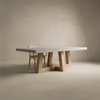 TimberCross concrete dining table with cane chair, light grey top on natural oak legs, studio shot
