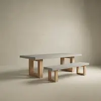 Studio render of the TimberStone concrete bench seat in light grey paired with matching dining table on natural Tasmanian Oak legs