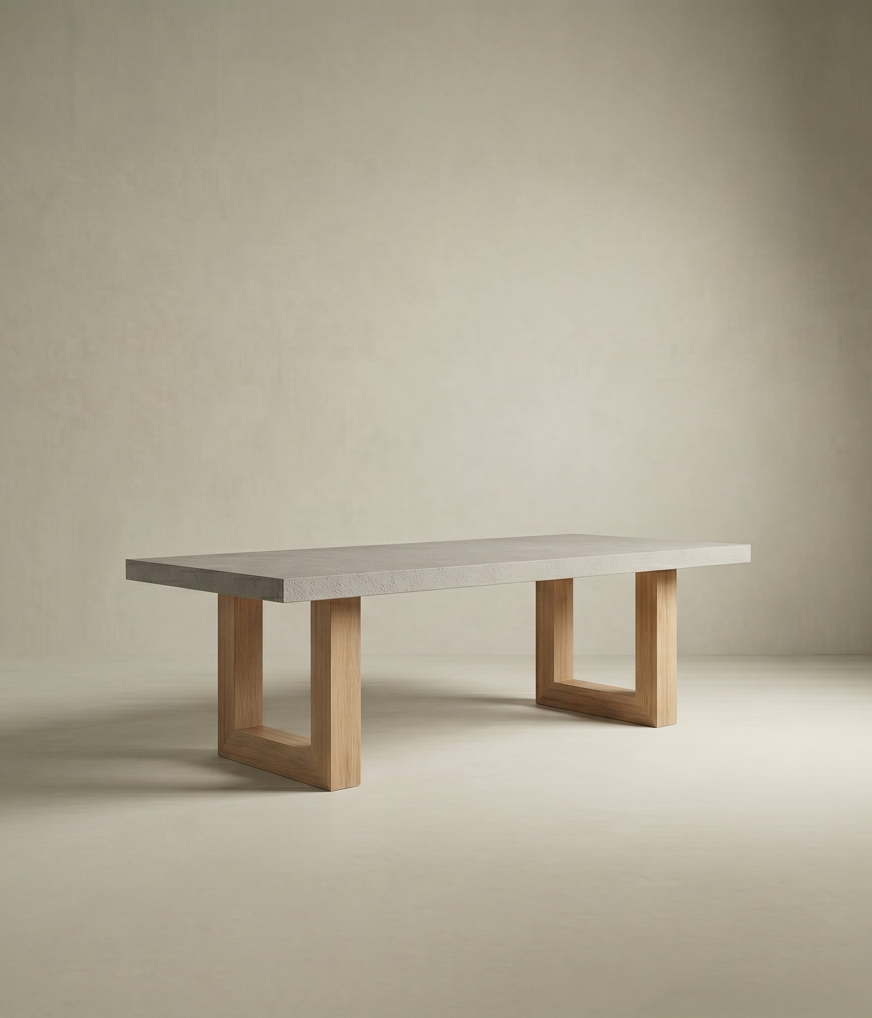 TimberStone concrete dining table with light grey slab top on natural oak square-frame legs, studio composition