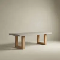 TimberStone concrete dining table with light grey slab top on natural oak square-frame legs, studio composition