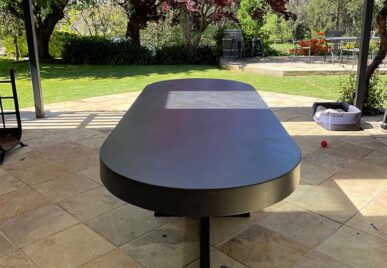 IronCross Oval Concrete Dining Table